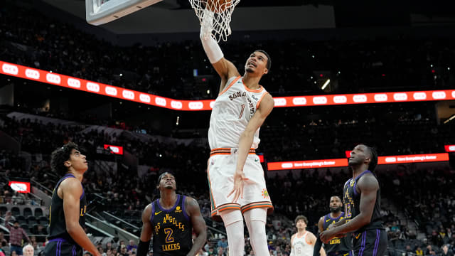 Dec 15, 2023; San Antonio, Texas, USA; San Antonio Spurs forward Victor Wembanyama (1) dunks during the first half against the Los Angeles Lakers at Frost Bank Center.